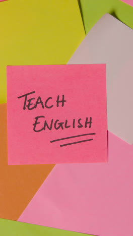 Vertical-Video-Education-Concept-Of-Revolving-Sticky-Notes-With-Teach-English-Written-On-Top-Note